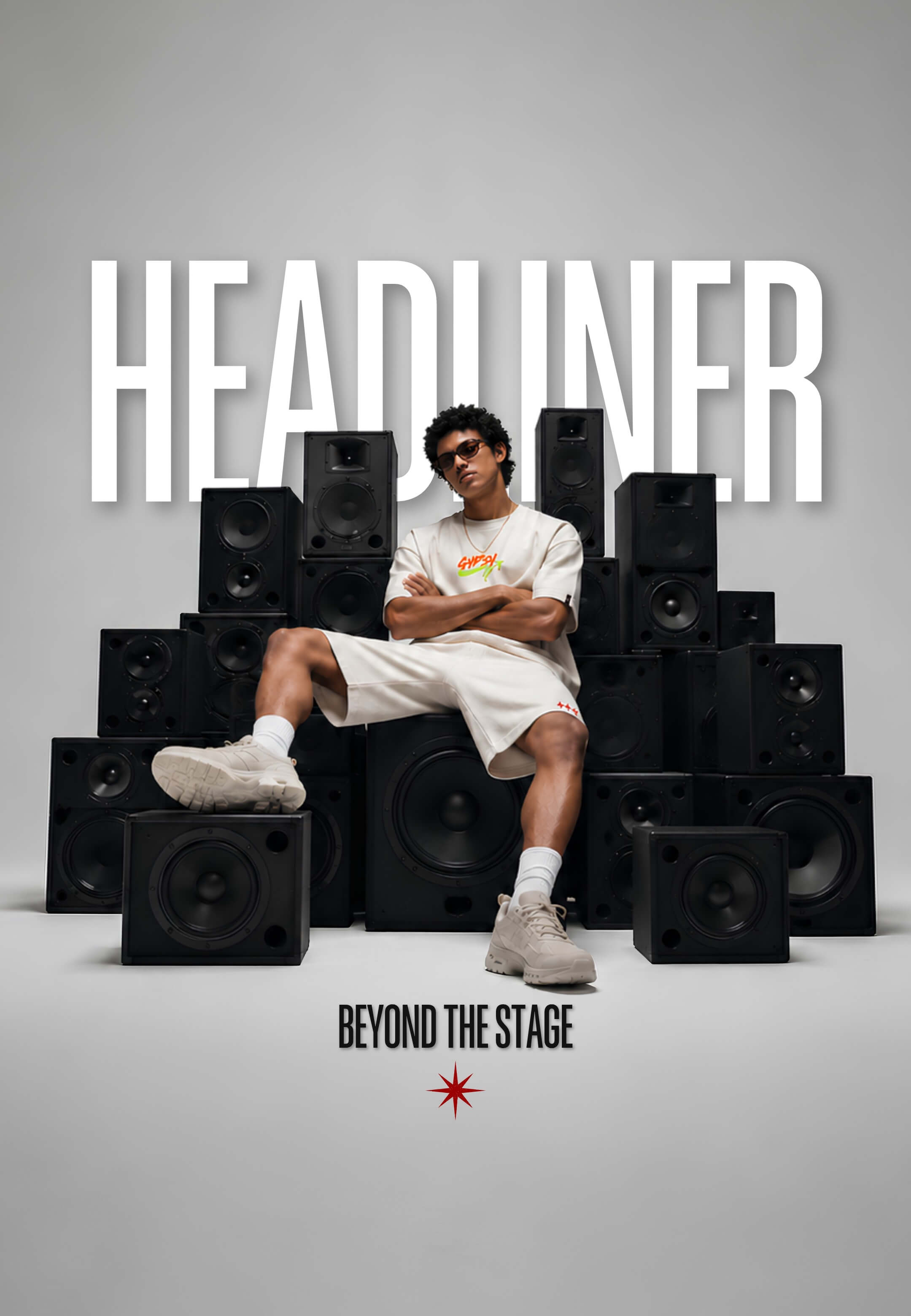 A promotional poster-style image for 'HEADLINER' featuring a seated man in a white t-shirt and shorts, sunglasses, and sneakers, surrounded by stacked black speakers. The text 'HEADLINER' appears in large white letters at the top, and 'BEYOND THE STAGE' with a small red star logo appears at the bottom.
