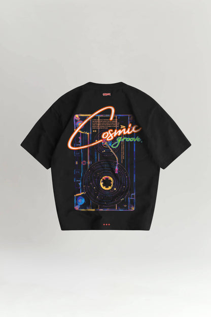 Black t-shirt with colorful 'Cosmic Groove' design on a light gray background