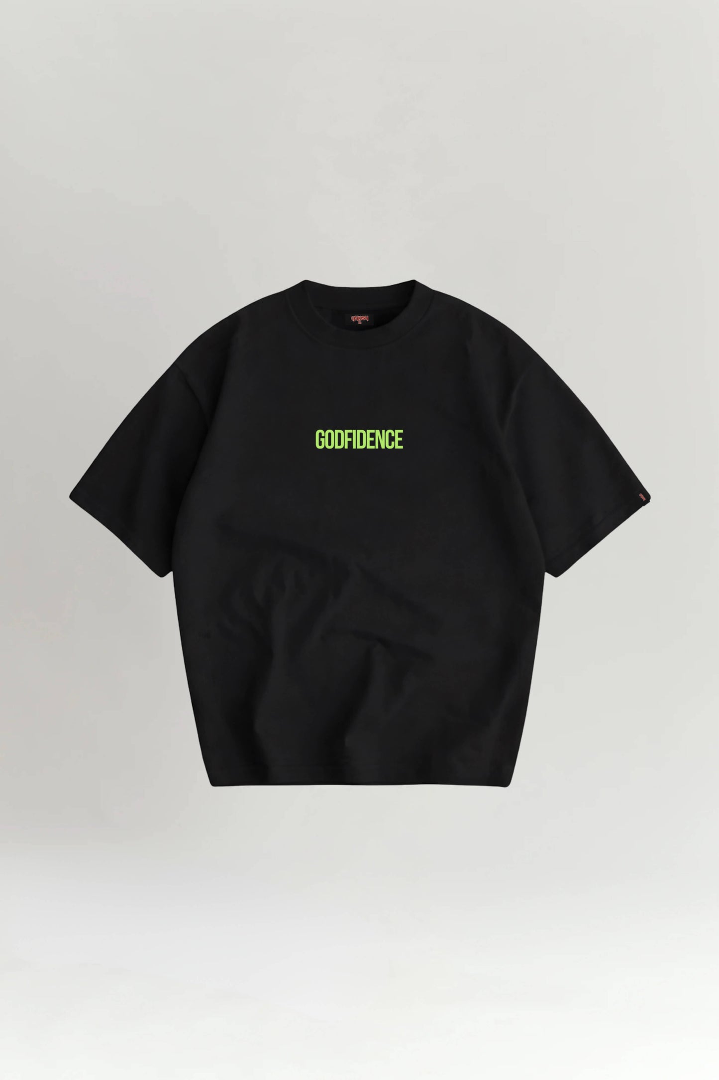 Black t-shirt with 'GODFIDENCE' text on a light gray background