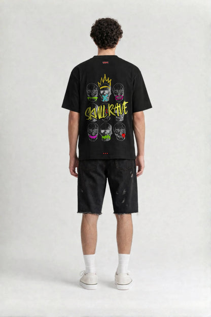 Person wearing a black t-shirt with colorful graphic design on the back, standing against a white background