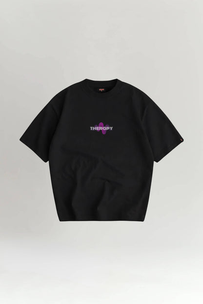 Black t-shirt with 'THERAPY' text on a light gray background
