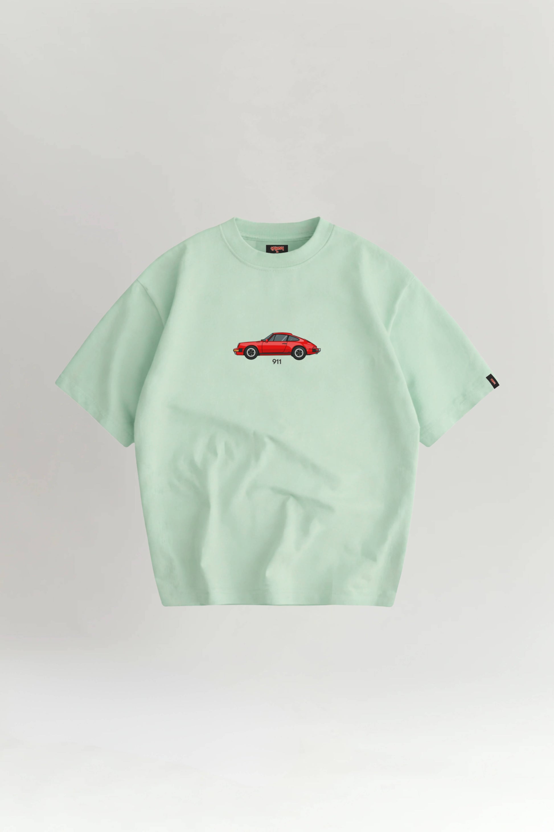 Light green t-shirt with a red car graphic on a white background