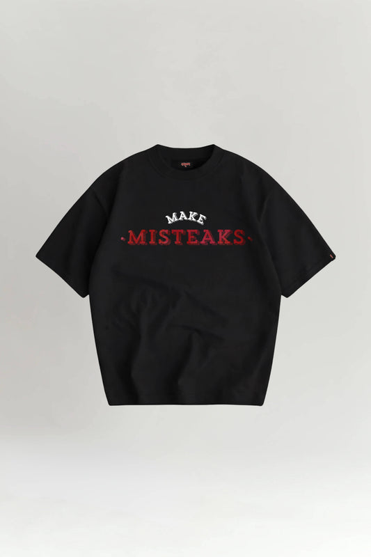 Black t-shirt with red and white text on a light gray background