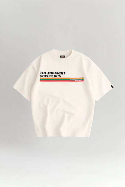 White t-shirt with colorful text and stripes on a gray background