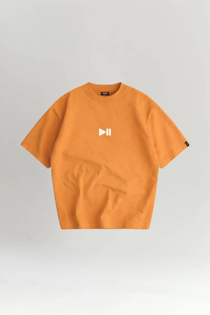 Orange t-shirt with a logo on a gray background