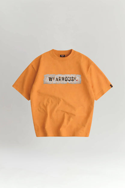 Orange t-shirt with 'WAREHOUSE' logo on a light gray background