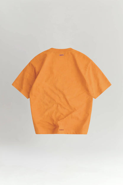 Orange t-shirt on a light gray background