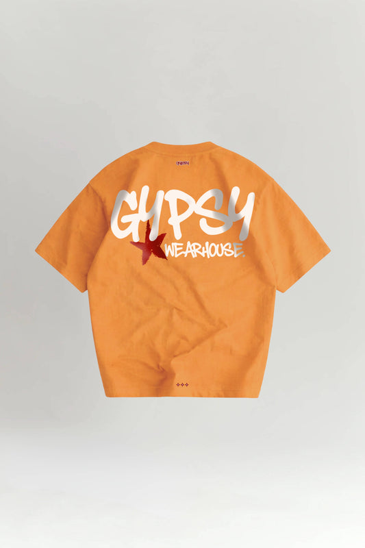 Orange t-shirt with white and red text on a light gray background